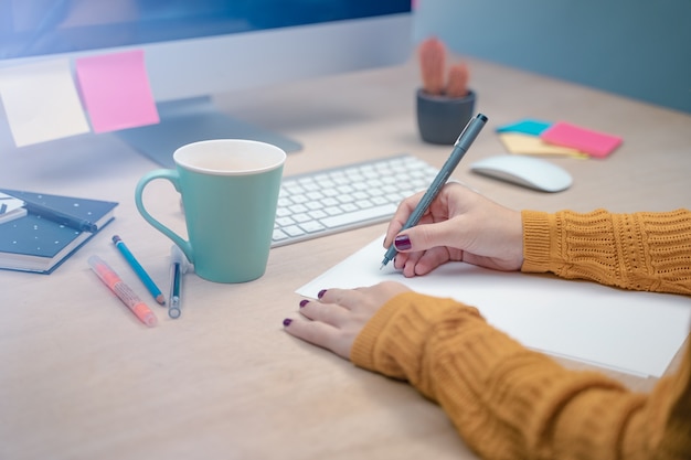 Business woman at morning at a creative studio Graphic design mock up screens