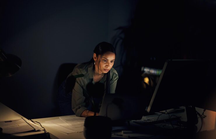 Photo business woman night and computer with web layout coding deadline and ux programmer in office internet typing and online at workplace with website update and coder with digital project in dark