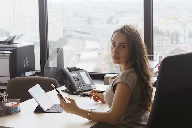 business woman office, ginseng sitting in the office at the table, work, business concept