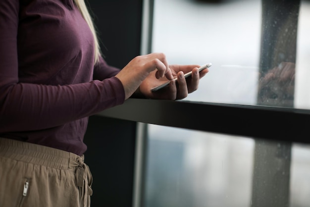 business woman at office using smart phone to check internet and type messages