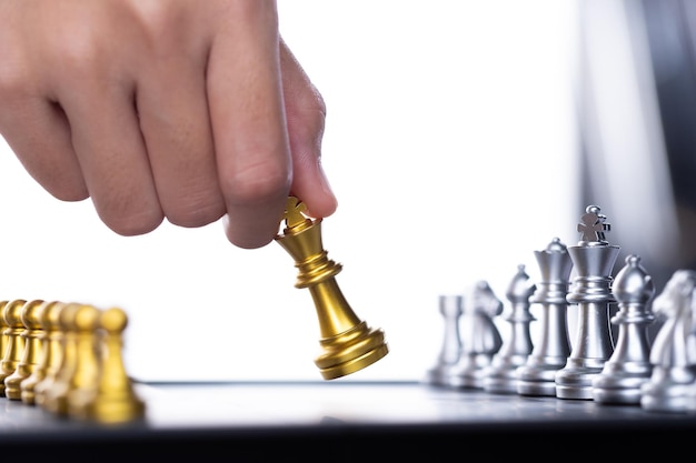 Business woman play chess to success leader use strategy game\
to challenge competitor with intelligence leadership power to move\
king to victory with management team idea battle to win copy\
space