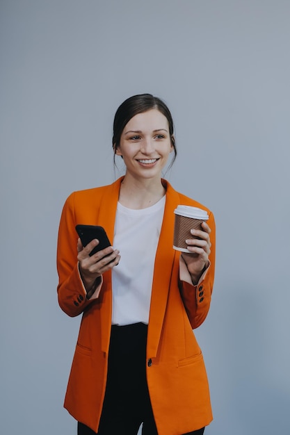 Business woman portrait with cup isolated Female model with long hair