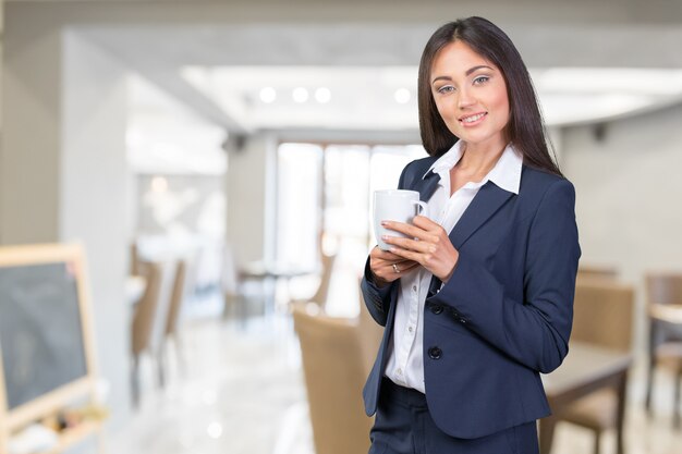 Business woman portrait with cup