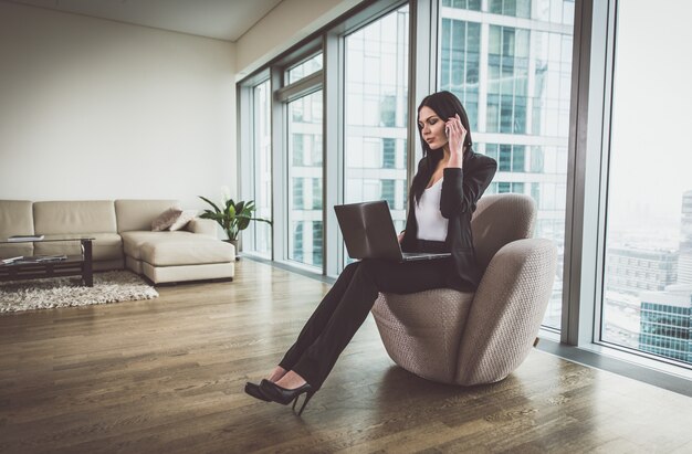 Business woman posing in her apartment