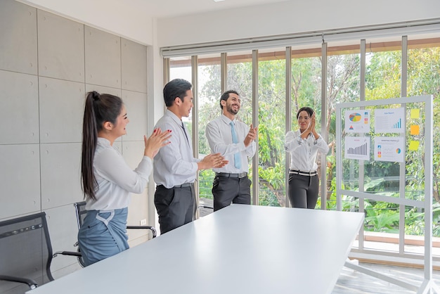 Business woman presentation plan marketing or project in future
in meeting room and team applauded