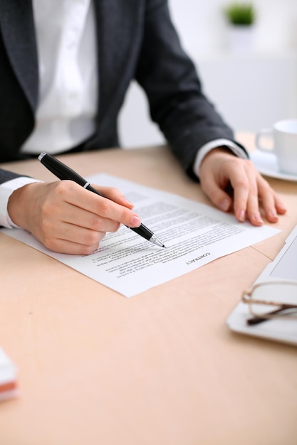 Business woman ready to sign a contract.