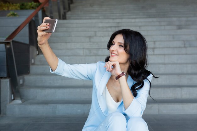 business woman resting on the stairs