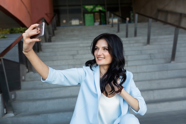 business woman resting on the stairs