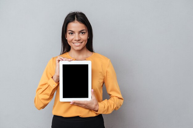 Business woman showing blank tablet computer screen