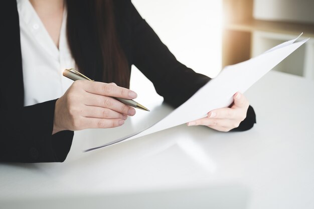 Photo business woman  sign a contract investment professional document agreement in meeting room.