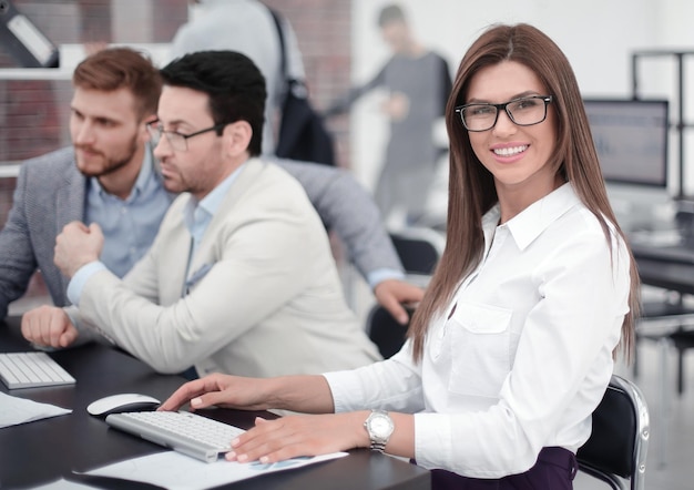 Business woman sitting at the office Desk photo with copy space