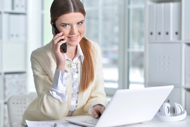 Business woman sitting at table