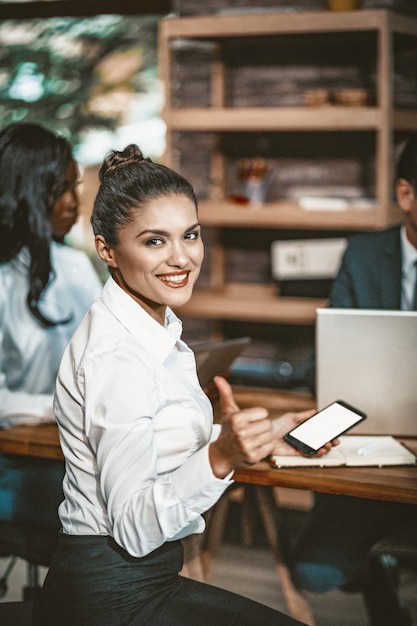 Business Woman Smiles During Corporate Meeting