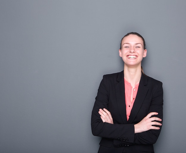 Business woman smiling with arms crossed