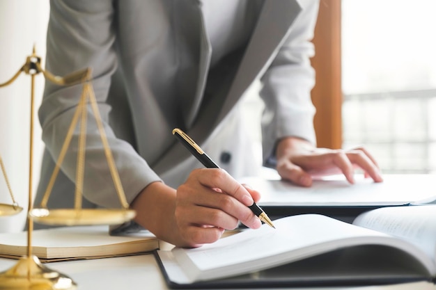 Photo business woman in suit or lawyer working on a documents