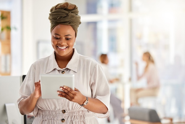 Business woman tablet and typing report in the office about positive employee review feedback Corporate lady feeling hope motivation and happy with helpful guidance for improvement in work