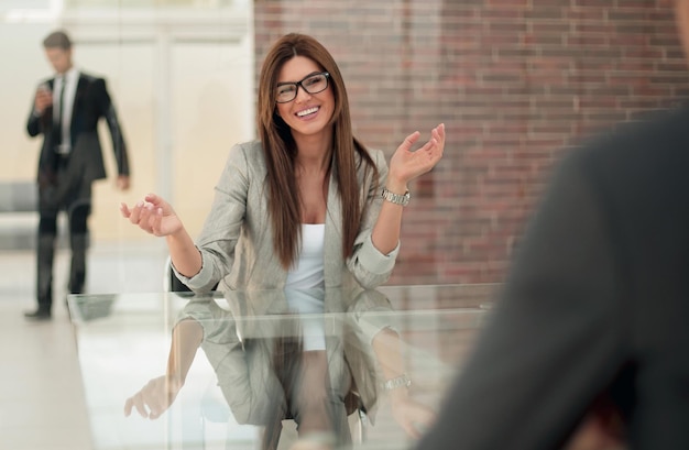 Business woman talking to a client in a Bank officephoto with copy space