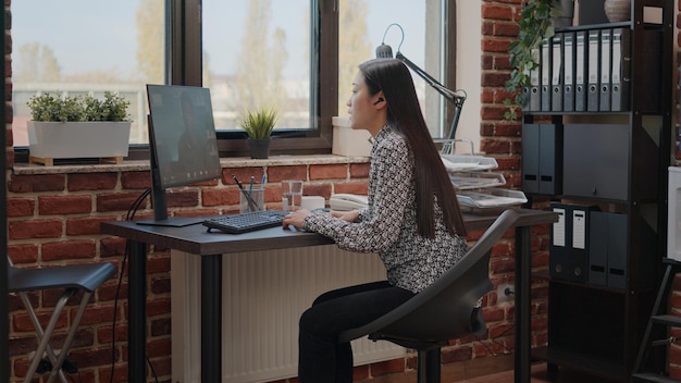 Business woman talking to man on online video call to plan\
project and strategy. entrepreneur using remote video conference to\
have conversation with colleague on computer. teleconference