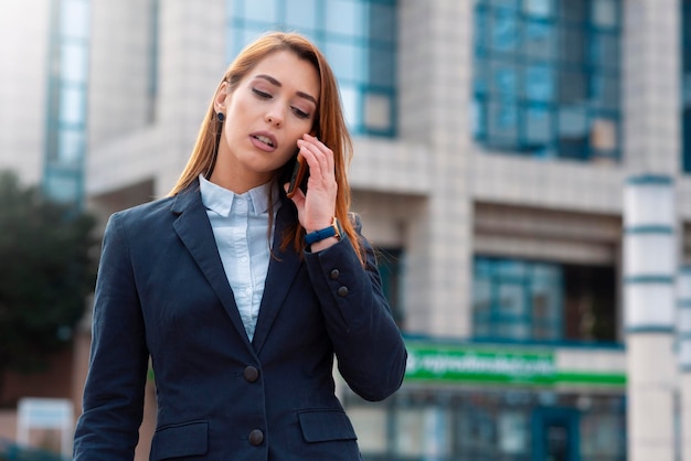 Business woman talking on phone outdoor