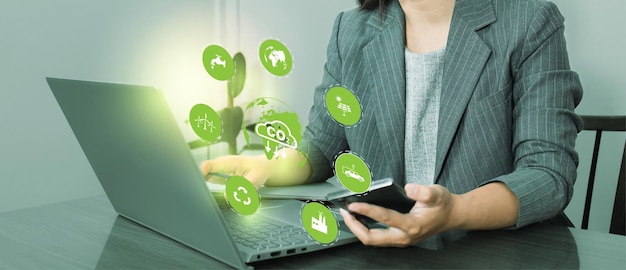 Business woman use computer to analyze Co2, CO2 environmental social governance investment business