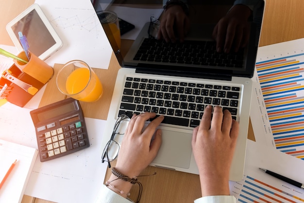 Business woman using laptop computer.