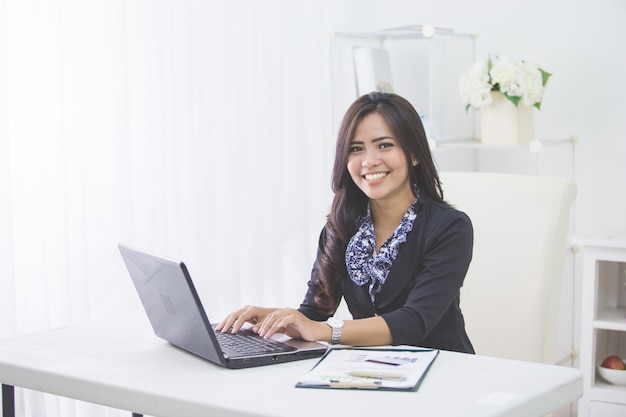 Business woman using laptop