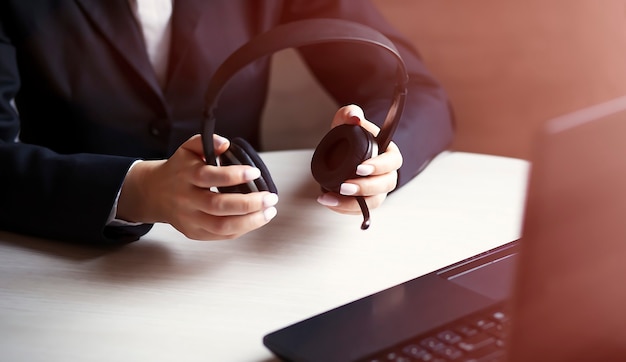 Business woman wearing headset on table