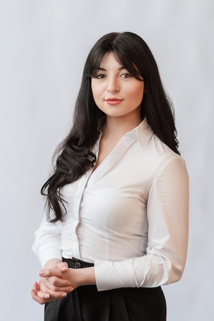 Business woman in a white shirt on a white background