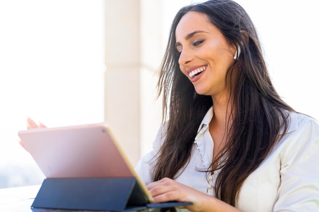 Business woman with headphones in a modern office