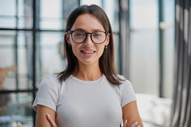 Business woman with her staff in background at office