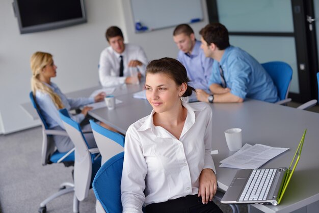 business woman  with her staff,  people group in background at modern bright office indoors