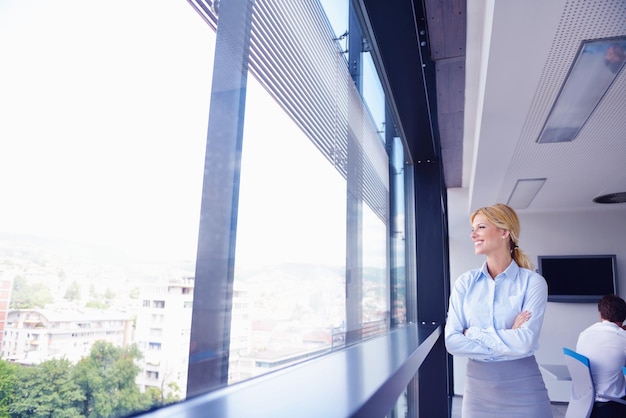 business woman  with her staff,  people group in background at modern bright office indoors