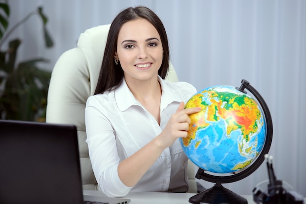 Business woman with notebook in the office.