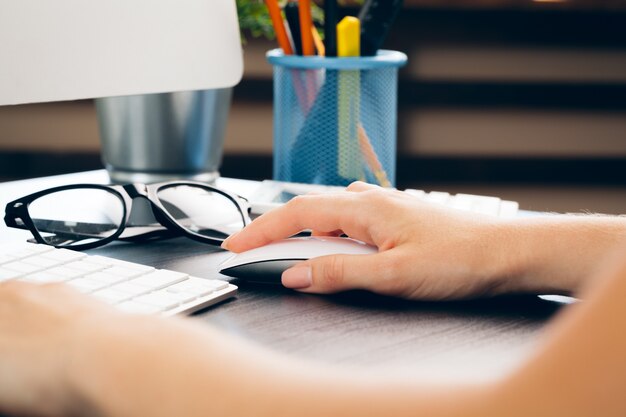 Business woman at work with laptop close up