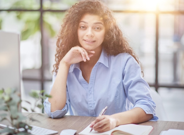 Business woman working at office with documents on his desk