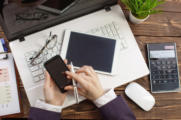 Business woman working in the office with items for doing business