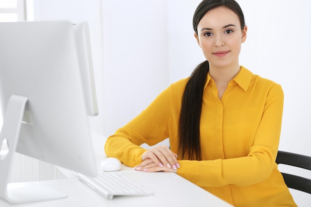 Business woman working with computer in office Headshot of Lawyer or accountant at work