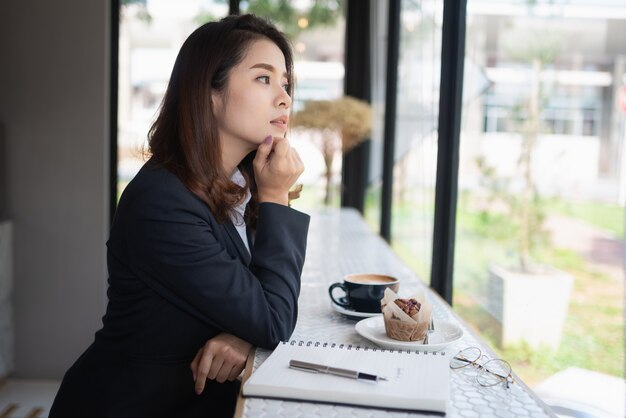 Business woman working with note book on the table, business concept