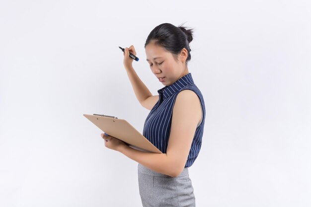 Business woman write on clipboard