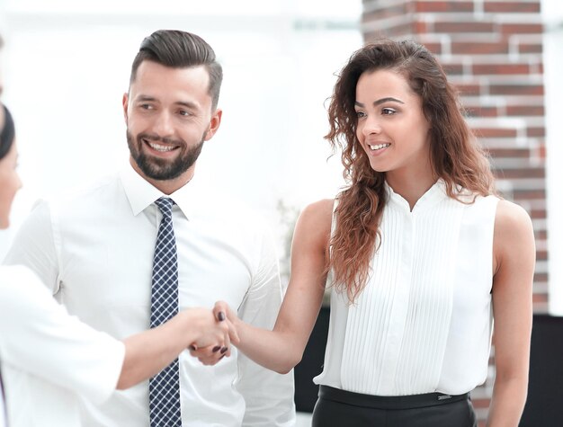 Business women greet each other with a handshake