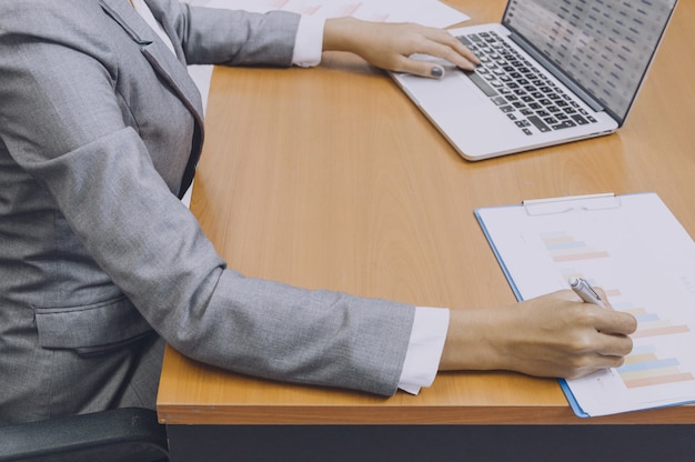 Business women hand signing on document