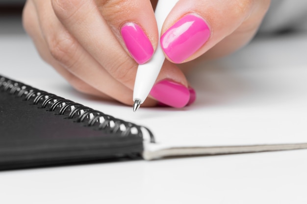 Photo business women hands writing notebook