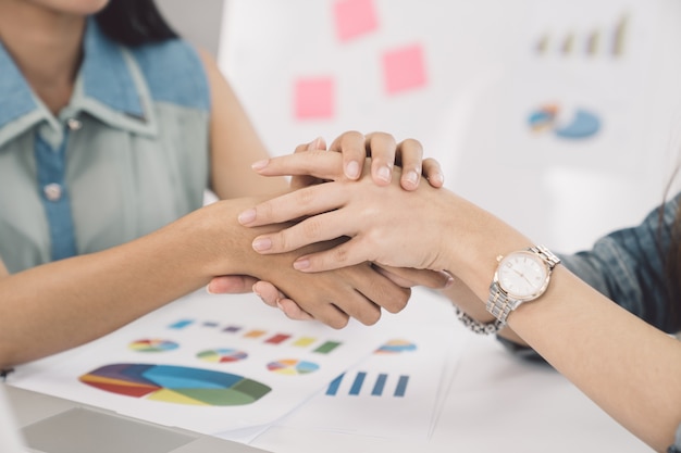 Business women shaking hands