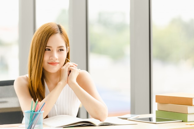 Business women sitting in office looking man with love