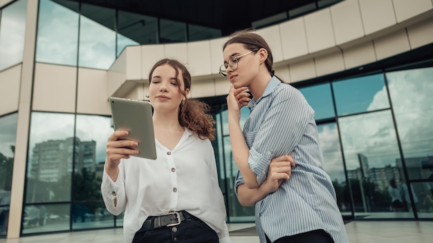 Business women speaking outside