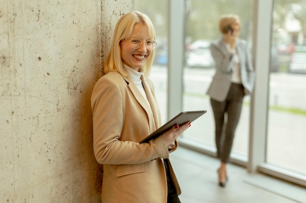 Business women standing in the office corridor