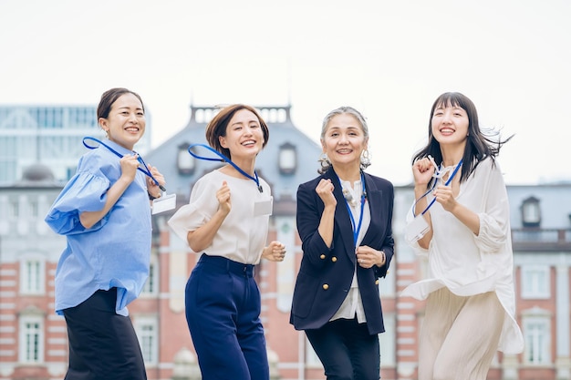 Business women of various ages who bounce vigorously