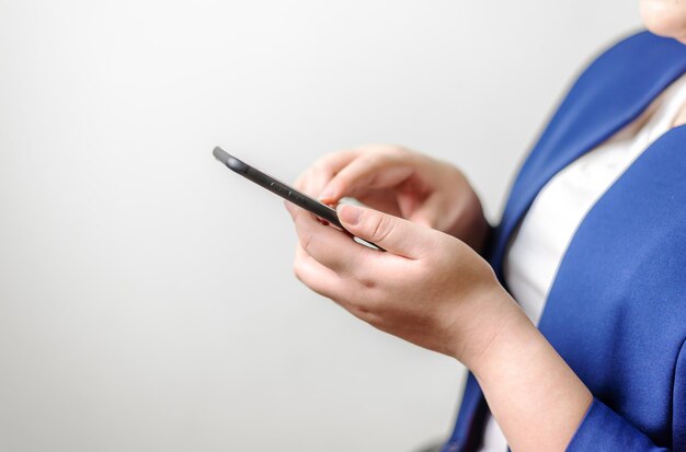 Business women with smartphone mobile on blurred background, Technology network and online banking and internet banking and networking people concept