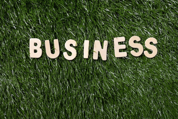 Business Wooden Sign On Grass