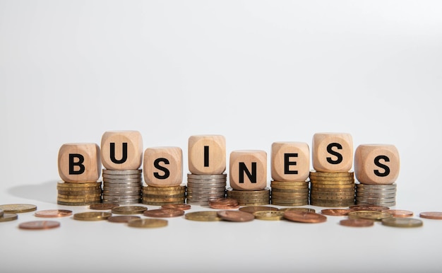 business word on wooden cubes over blur background business concept